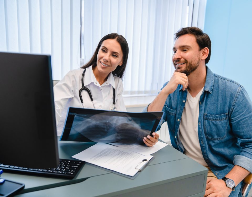 Doctor diagnosing patient's health with radiological chest x-ray film for medical healthcare service