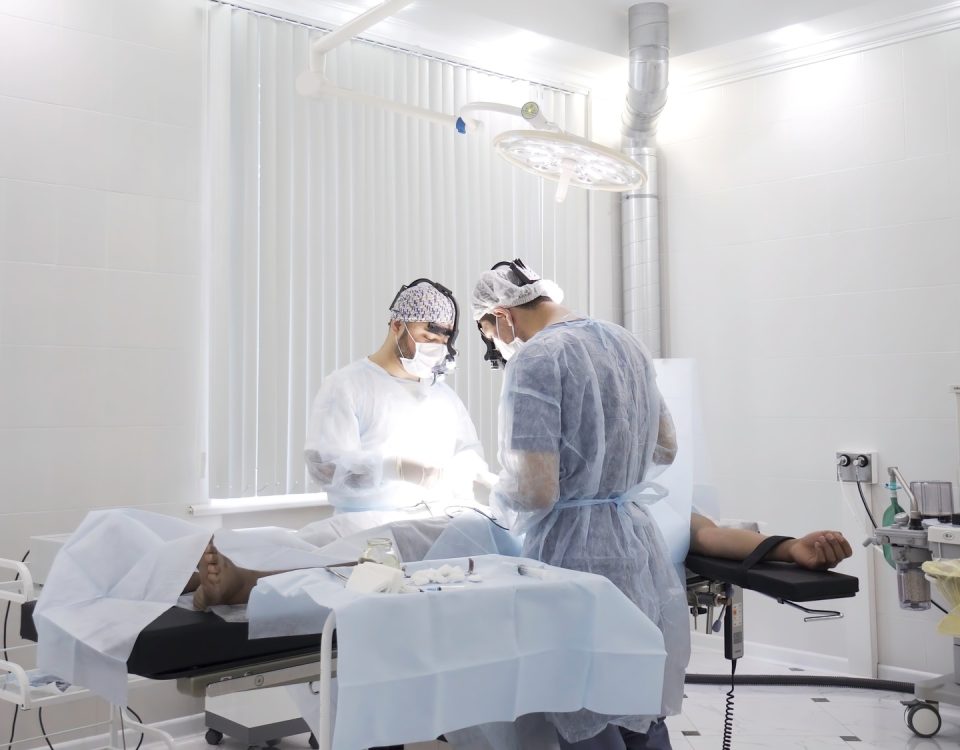 Team of doctors perform surgery while patient is under anesthesia. Action. View inside of the