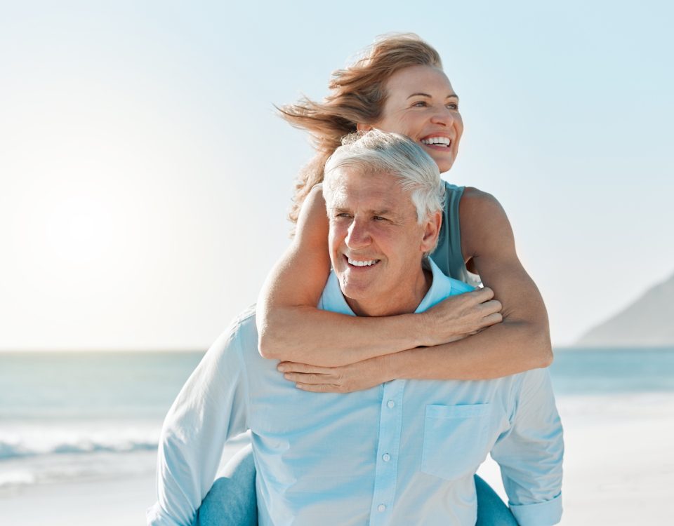 Just enjoying our free time. Shot of a mature couple spending time together at the beach.