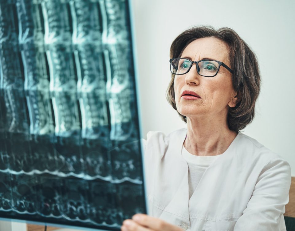 Serious female vertebrologist focused on her work
