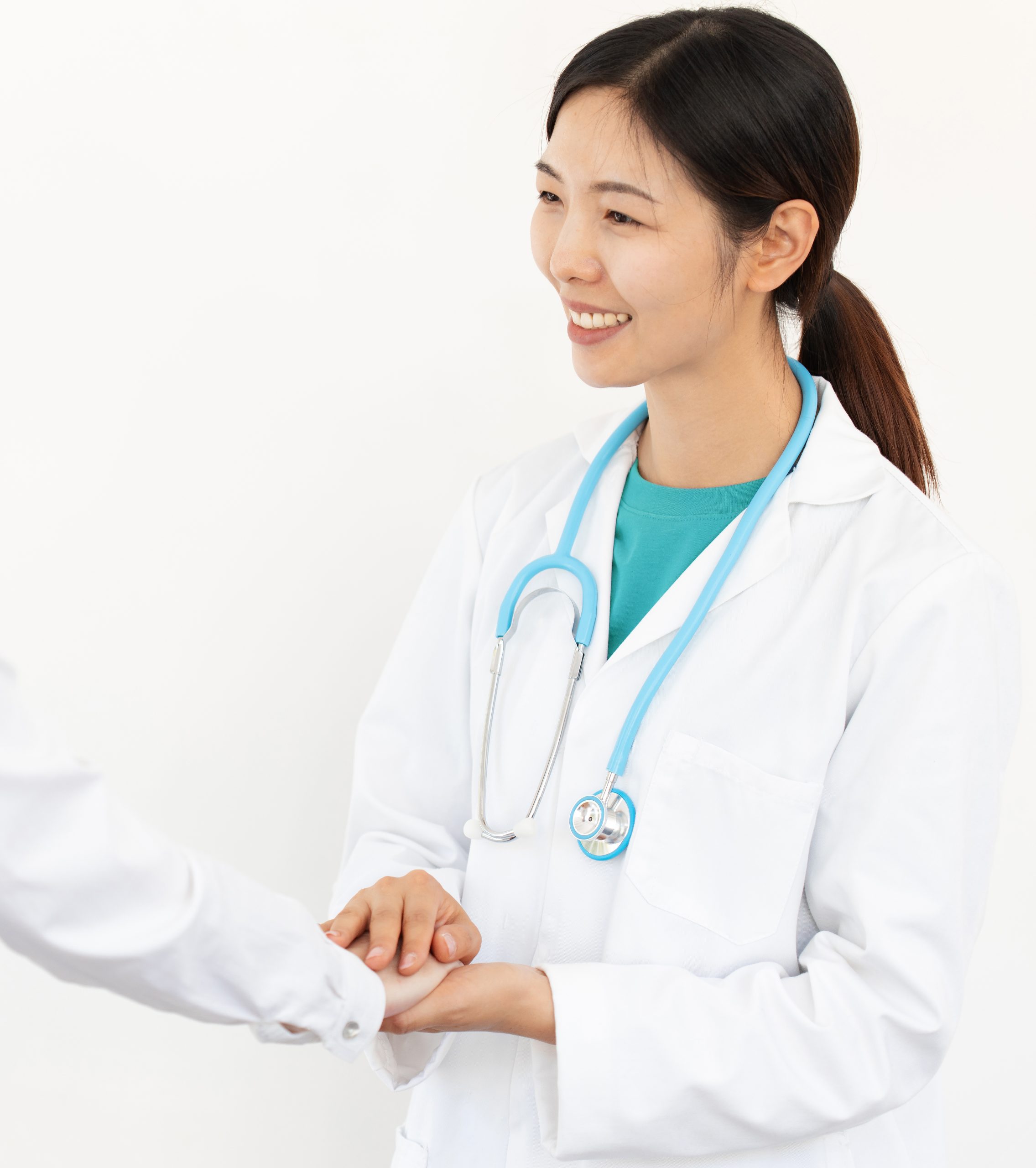 young woman doctor in white coat and stethoscope reassuring the patient